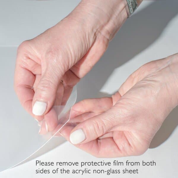 Hands demonstrating the process for removing the protective film from both sides of the acrylic front