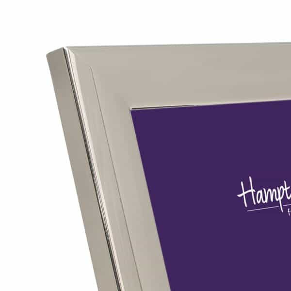Silver picture frame corner with purple background.