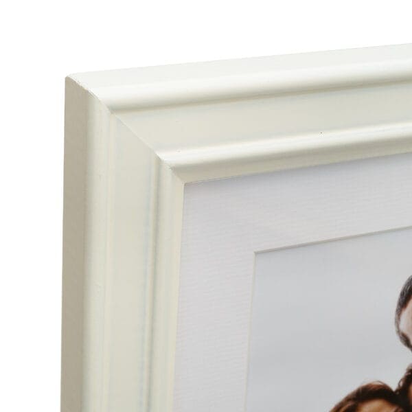 Close-up of white picture frame corner detail.