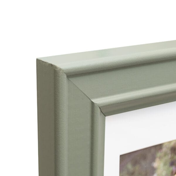 Green wooden picture frame corner detail