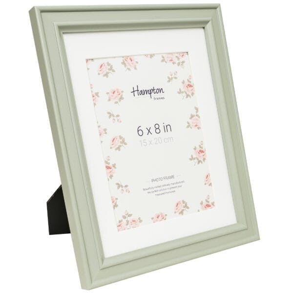 Green photo frame with floral design, 6x8 inches.