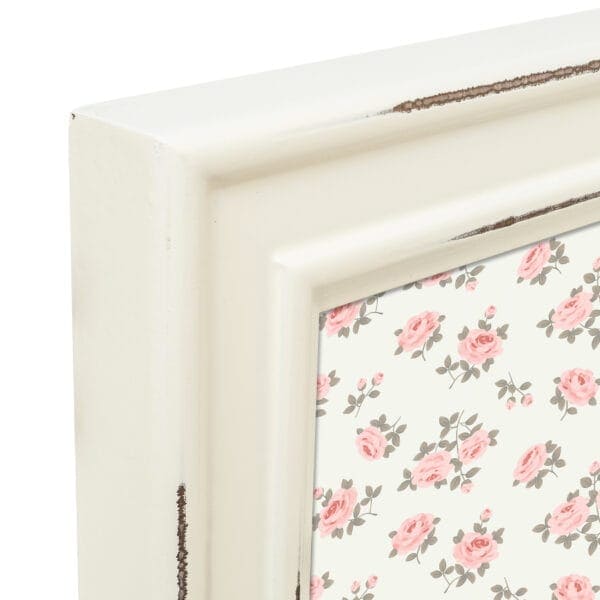 Close-up of vintage frame with floral pattern