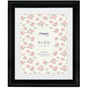 Black photo frame with floral design insert, 8x10 inches.