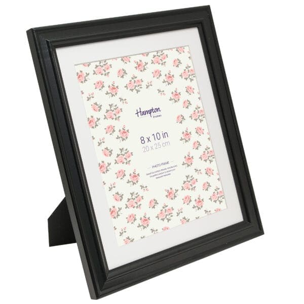 Black photo frame with floral background.