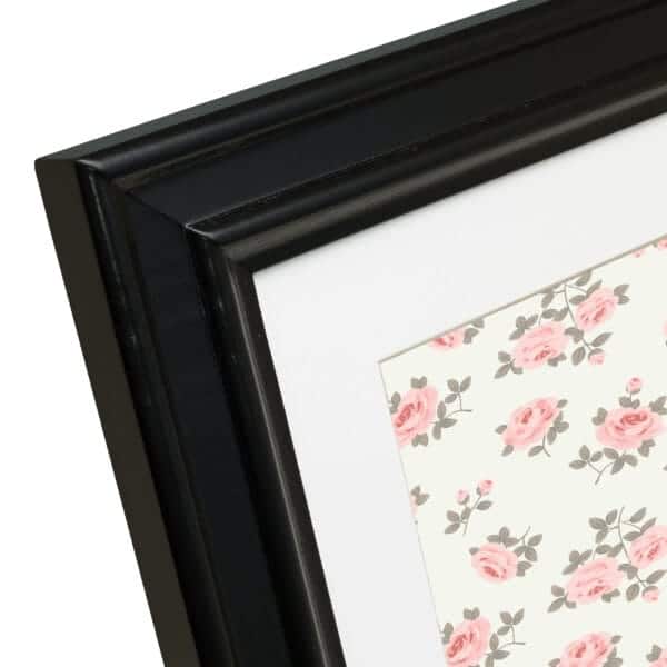 Black frame with floral rose pattern.
