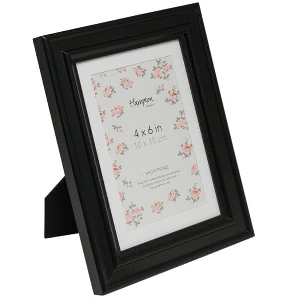 Black photo frame with floral design, 4x6 inches.