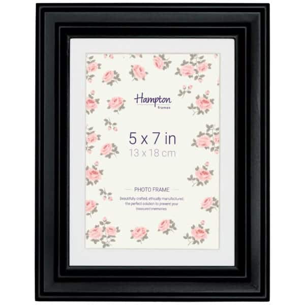 Black photo frame with floral design insert, 5x7 inch.