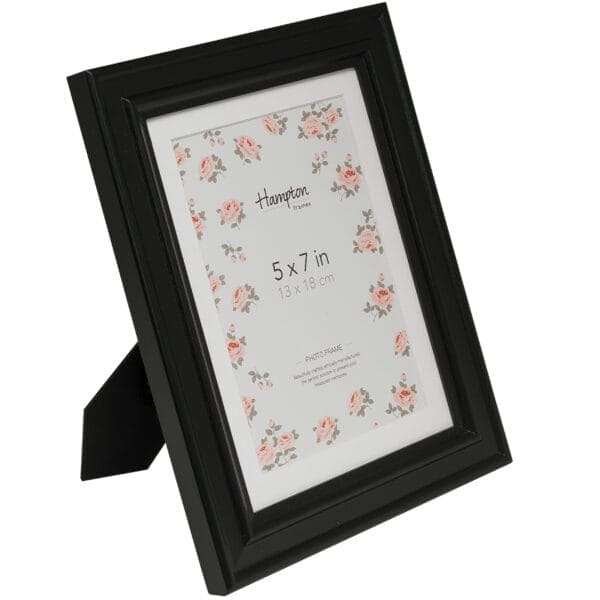 Black 5x7 inch photo frame with floral background.