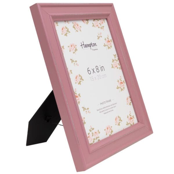 Pink photo frame with floral design, 6x8 inches.