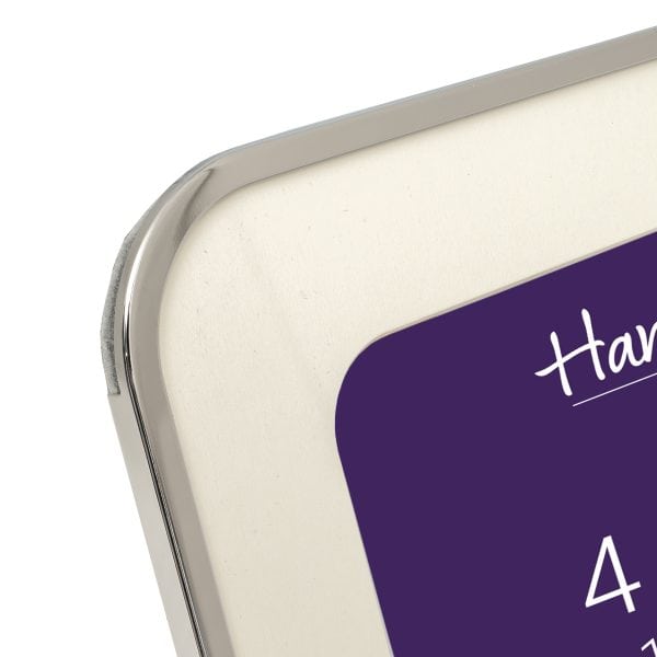 Close-up of rounded metal-framed sign corner